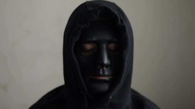 anonymous in mask,criminal thief or enemy terrorist