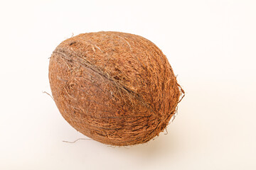 Tropical brown coconut over background