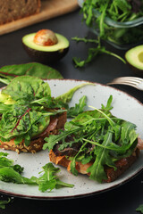 Sandwiches with salmon, avocado and salad
