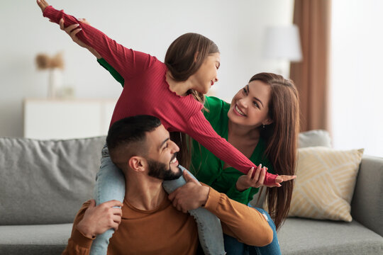 Portrait of cheerful happy Arab family having fun at home