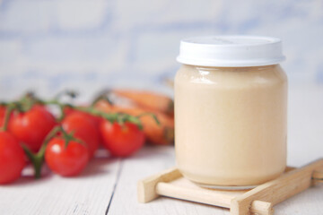 baby food in a container on table with copy space.