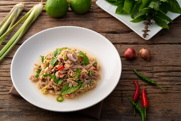 Spicy Lemongrass Salad with Canned tuna fish on white plate.Asian food