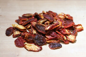 Sun dried tomatoes pile isolated on white background