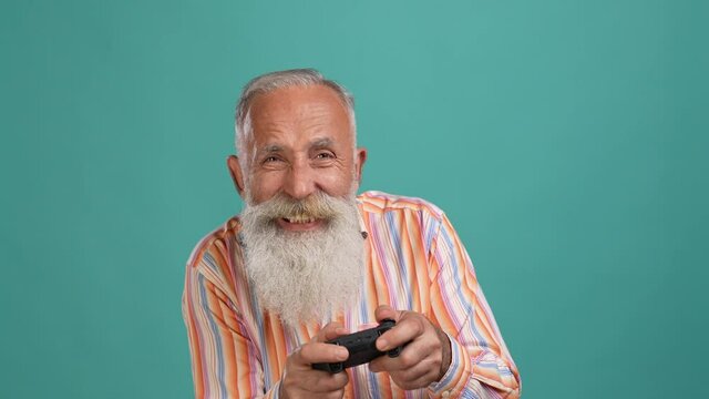 Middle aged man addicted play lose game isolated aquamarine color background