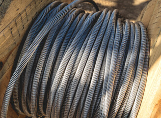 Background of wooden coils of electric cable outdoor.