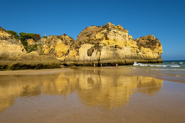 Fototapeta na wymiar Beach of the Three Brothers, Praia dos Tres Irmaos in Portimão, Algarve, Portugal