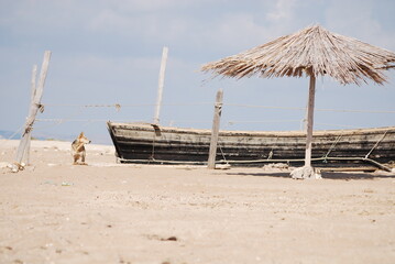 Fototapeta na wymiar Temporary refuge for fishermen on a sand spit