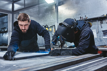 We're the welders. Welders working at the factory