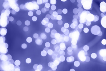 Fototapeta premium Defocused Very Peri colour tones abstract christmas background. Texture Bokeh. 2022 New year.