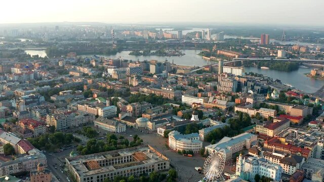 Top view of Podol. Many buildings and churches. Evening view of the river Dnipro.