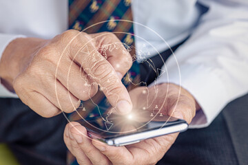 A man using a smartphone to connect to global business partners. Telecommunication, internet connectivity, teleconference with concept of big data information technology.