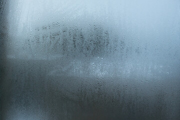 Frozen raindrops on a window pane