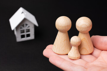 House and wooden figurines as  life insurance concept