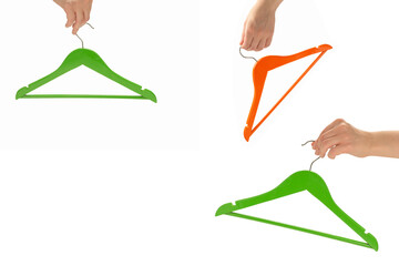 Green hanger in woman hand isolated on white