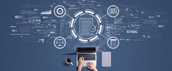 Compliance concept with person working with a laptop