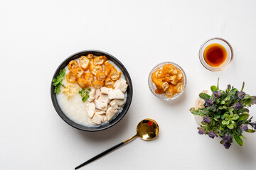 Rice porridge with fish isolated on white background with negative space.