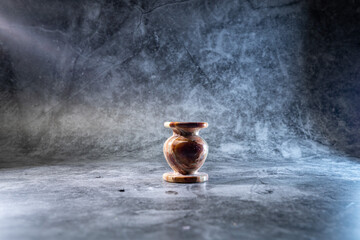 onyx candlestick on a gray background with illumination