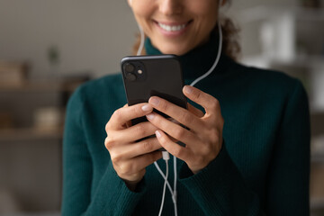 Crop close up of smiling Latino woman use cellphone talk speak on video call online on device. Happy Hispanic female have webcam digital virtual communication on smartphone. Technology concept.