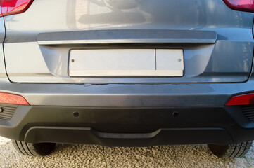 close-up - the rear of the car with damage to the bumper after an accident
