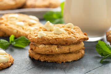 White Chocolate Caramel soft baked cookies served with glass of milk