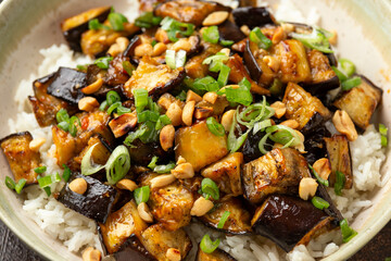 Asian Eggplant with rice, peanuts and spring onion. Healthy food.