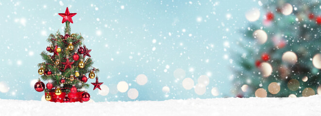 Christmas Tree with decoration on a winter background.