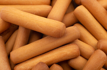 Bread sticks close up. Background from snacks in the form of sticks. Grissini