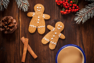 Gingerbread man cookies and coffee cup by horizontal angle. - 474554859