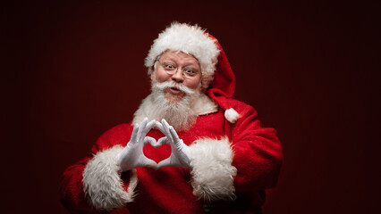 Santa Claus with heart sign