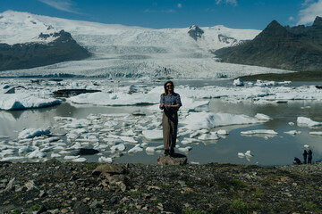girl on Jokulsarlon glacier lagoon, Vatnajokull national park, Iceland - obrazy, fototapety, plakaty