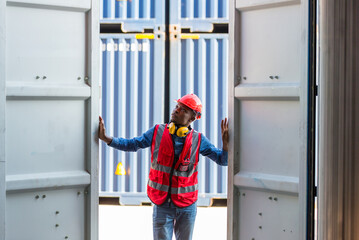 Fototapeta na wymiar Professional foreman work at Container cargo site check up goods in container. Workers are opening containers for inspection and check.
