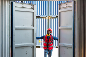 Fototapeta na wymiar Professional foreman work at Container cargo site check up goods in container. Workers are opening containers for inspection and check.