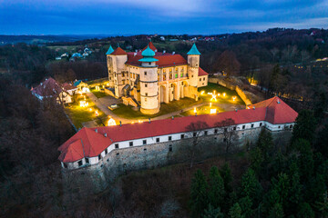 Castle in Nowy Wisnicz Poland, Illuminated at Evening. Drone View