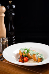 Sliced chicken cordon bleu with creamy sauce