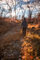 child walking in autumn park