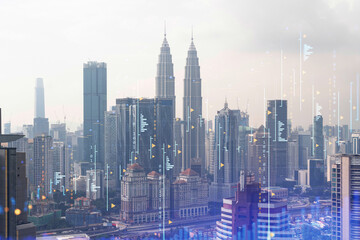 Forex and stock market chart hologram over panorama city view of Kuala Lumpur. KL is the financial...