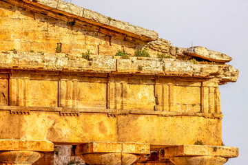 Ruin of a Greek temple at Paestum. Beautiful view of famous Paestum Temples Archaeological UNESCO World Heritage, scenic golden evening light at sunset, Province of Salerno, Campania, Italy