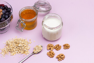 Honey and yogurt in glass jars.