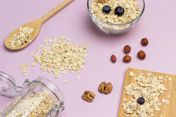Oatmeal on board, in jar and in bowl.