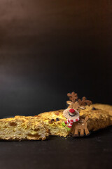 Christmas stollen. Festive cupcake. Homemade baking. What to cook for the New Year. Restaurant background. Sweet food and toy fawn. New Year's Attribute.