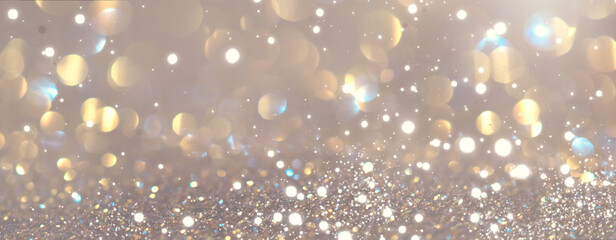 Abstract glowing gold bokeh background. Golden holiday glow backdrop. Defocused Background With...