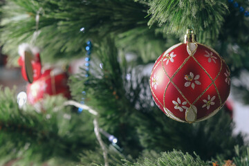 New Year's Eve and Christmas, red Christmas ball on the Christmas tree