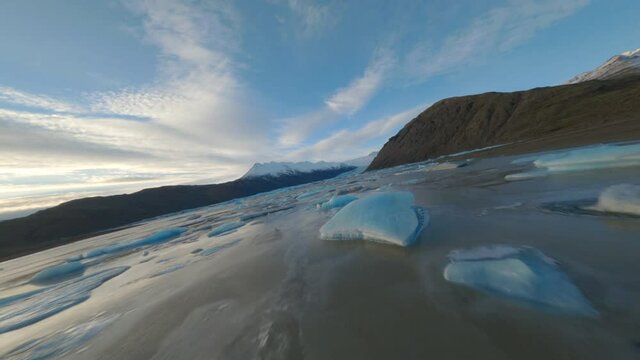 Aerial fpv view of man jumping on Glacier skaftafell, Vatnaj&ouml;kull National Park. Iceland.