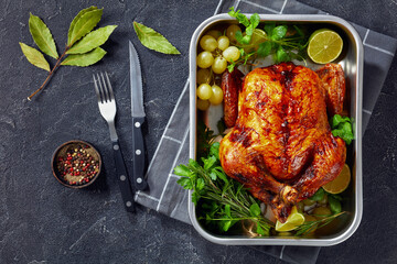 whole roast chicken in a baking dish