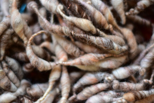 background photo of textured handspun art yarn