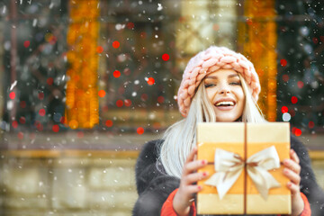 Emotional lady enjoying gift at the new year fair