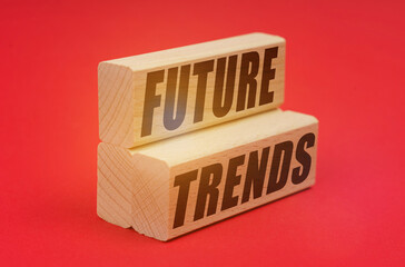 On a red background, wooden blocks with the inscription - FUTURE TRENDS