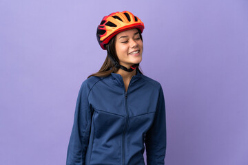 Teenager cyclist girl looking to the side and smiling