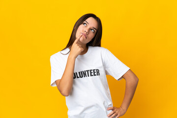 Teenager volunteer girl having doubts while looking up