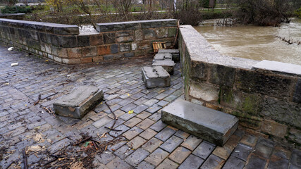 the river with a strong current destroyed the bridge. flood
